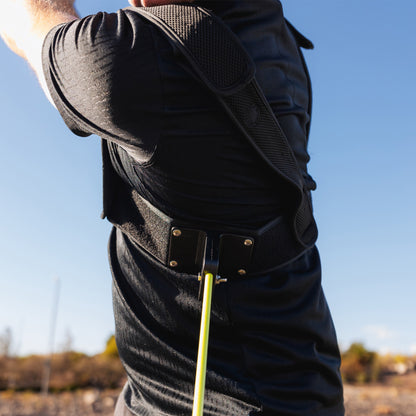 Man swinging a golf club with closeup of swizzlestick